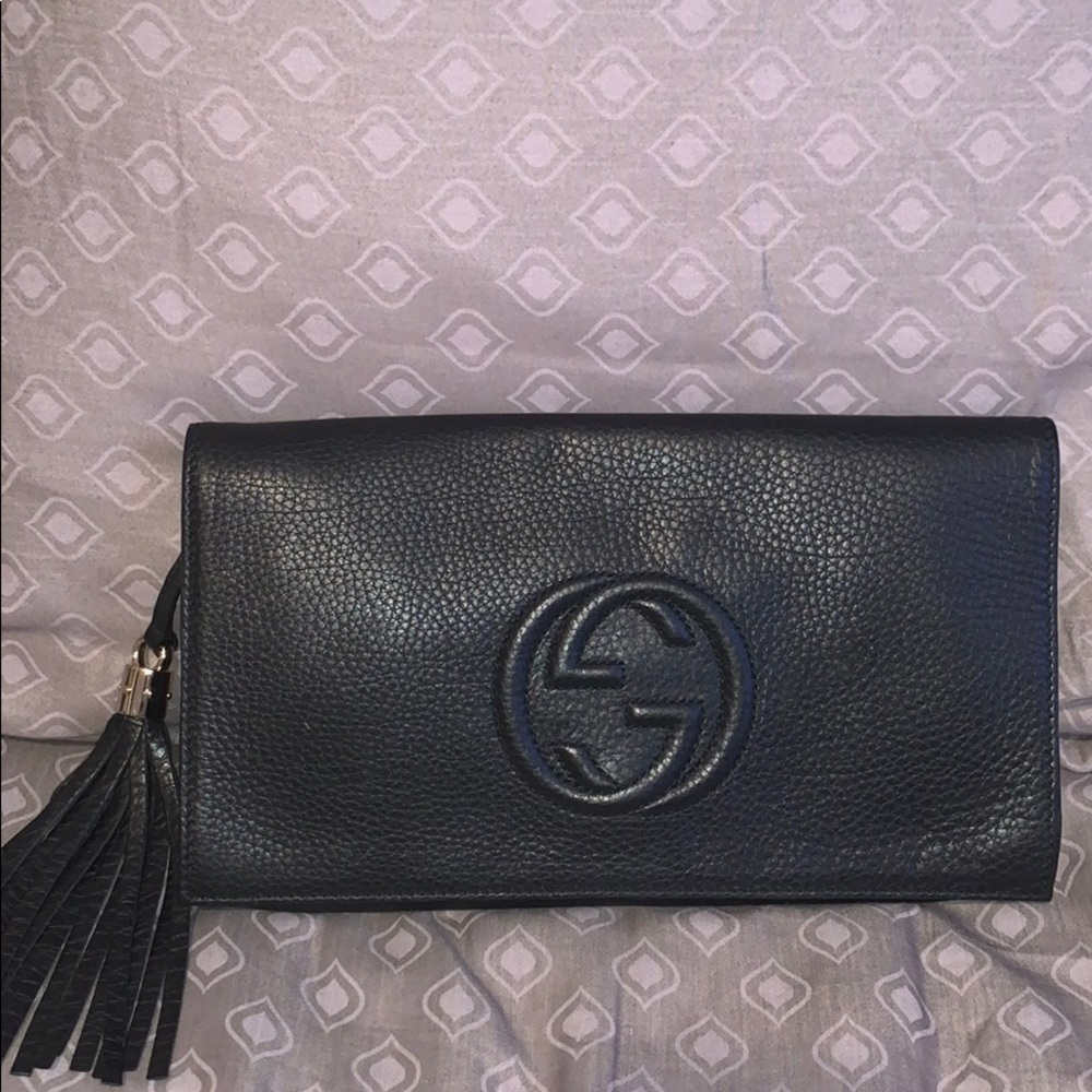 Black leather Gucci clutch